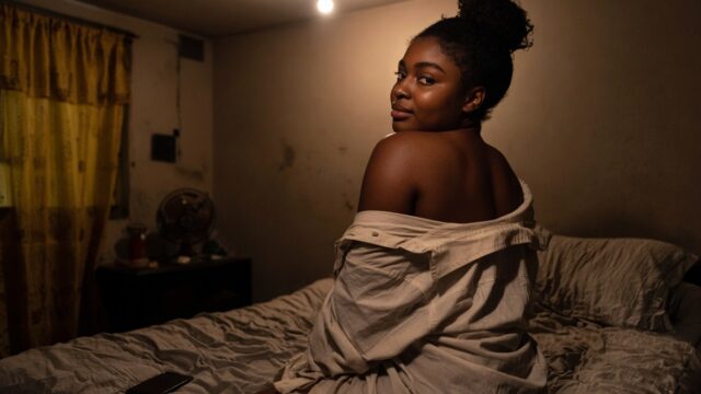 Nacknaija leaks category – curvy Naija woman on a bed in a dim Lagos room, leaked amateur sextape vibe